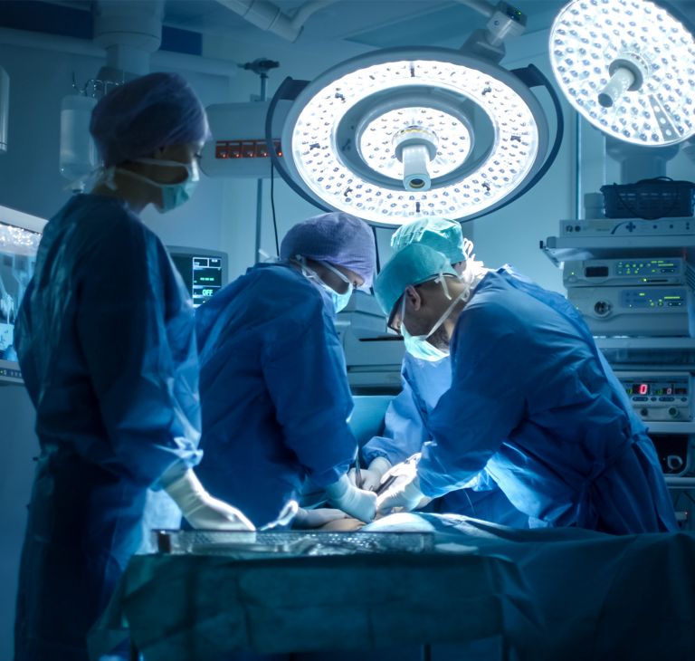 Medical professionals performing a surgery. 