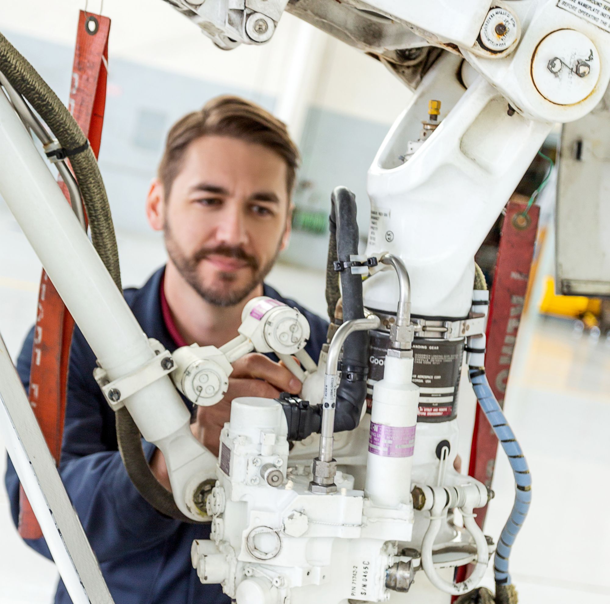 A person works on pumping equipment. 