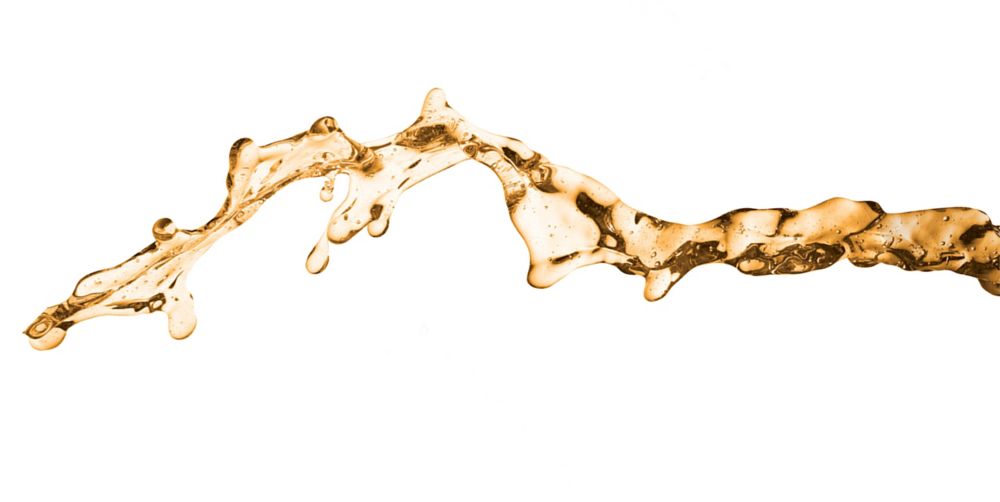 Splash of golden flushing fluid. 