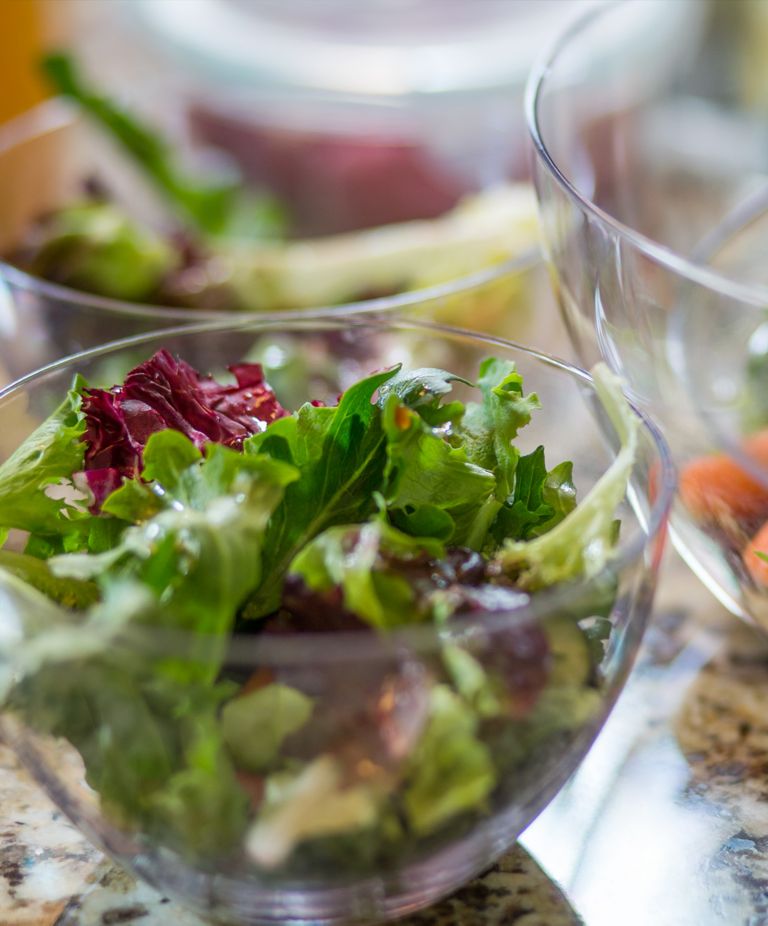 A salad in a clear, glass-like bowl made from Tritan. 