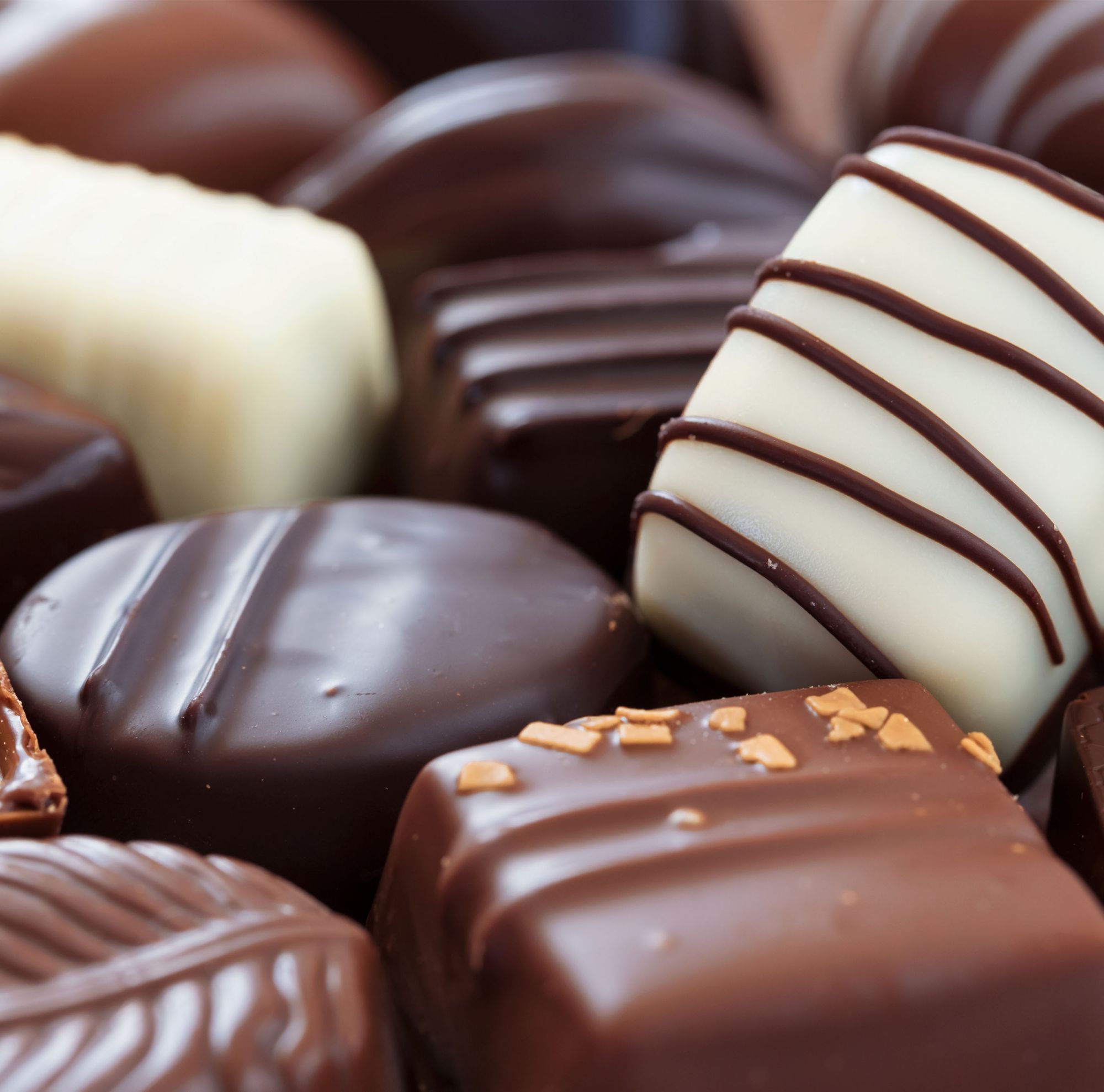 A variety of white, dark and milk chocolate candies. 