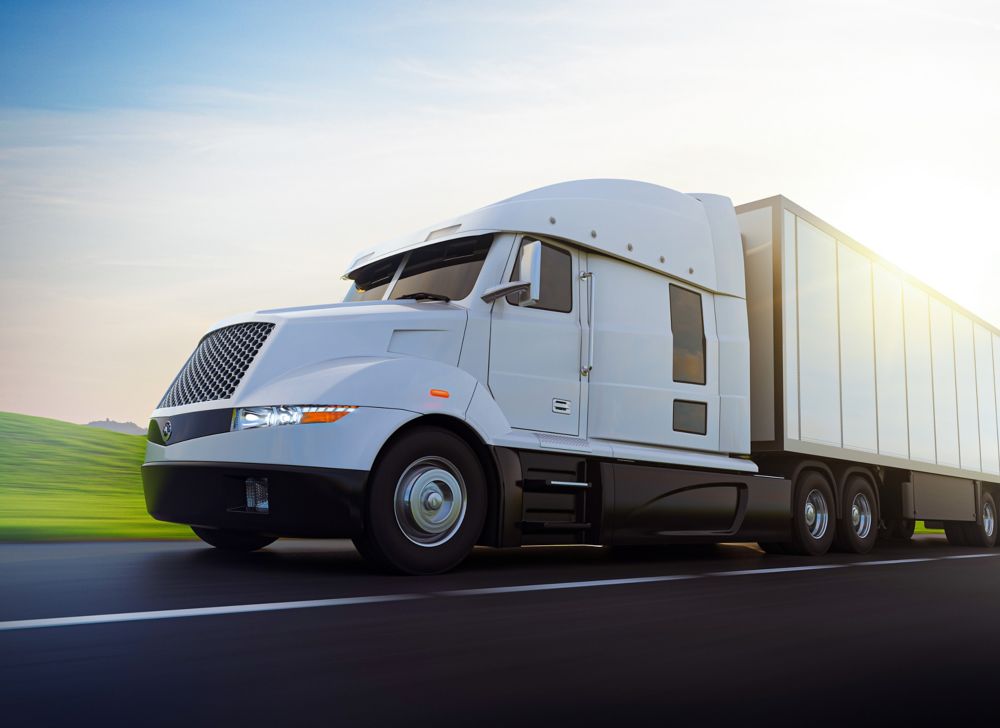 Tractor trailer driving on road. 