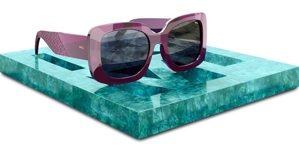 Sunglasses with purple plastic frames and ultra polarized lenses. 