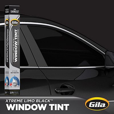 Gila® XTREME LIMO BLACK Tint packaging in front of car