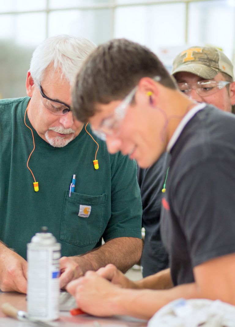 Eastman employees working on a project 