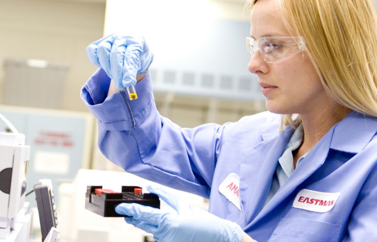 Eastman team member works in a lab to develop materials that create possibilities 