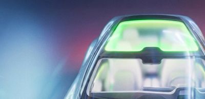 Car sunroof highlighted with green lighting. 